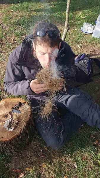 Making fire to cook fish